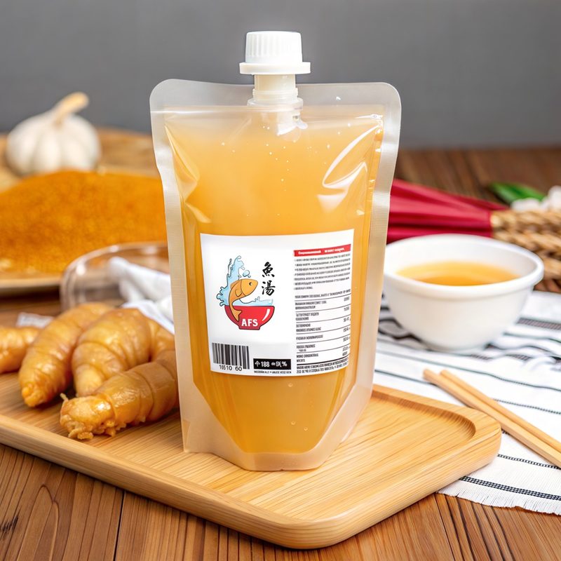 A pouch of frozen Arcade Fish Soup broth beside a bowl of soup